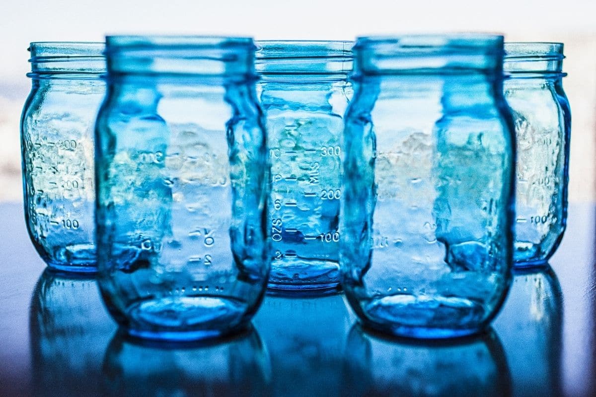 Blue mason jars in natural light.