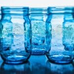 Blue mason jars in natural light.