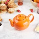 Orange mircowave teapot on kitchen table