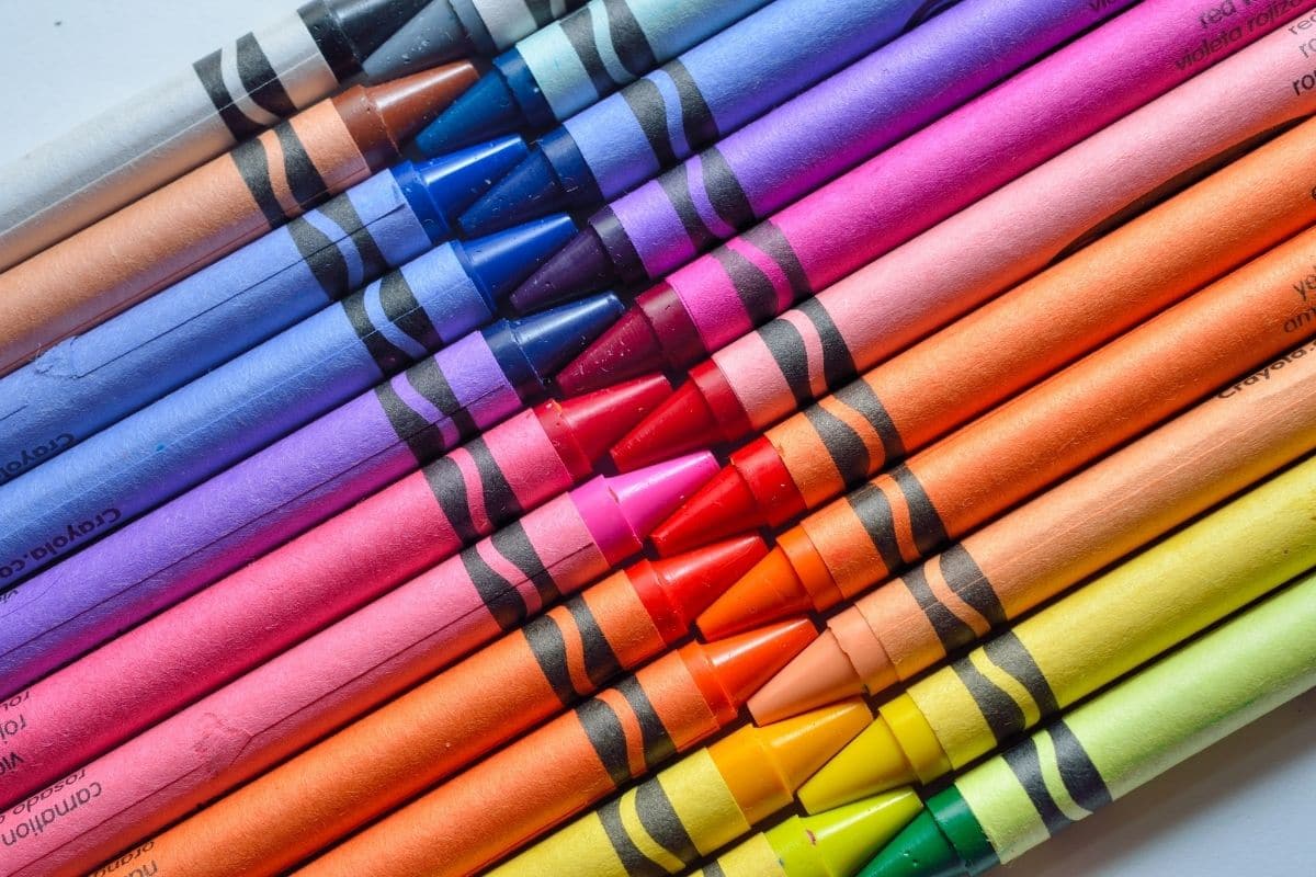 Bunch of stacked colorful crayons.