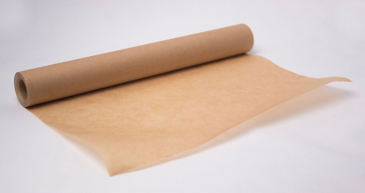 Roll of parchment paper on white background.