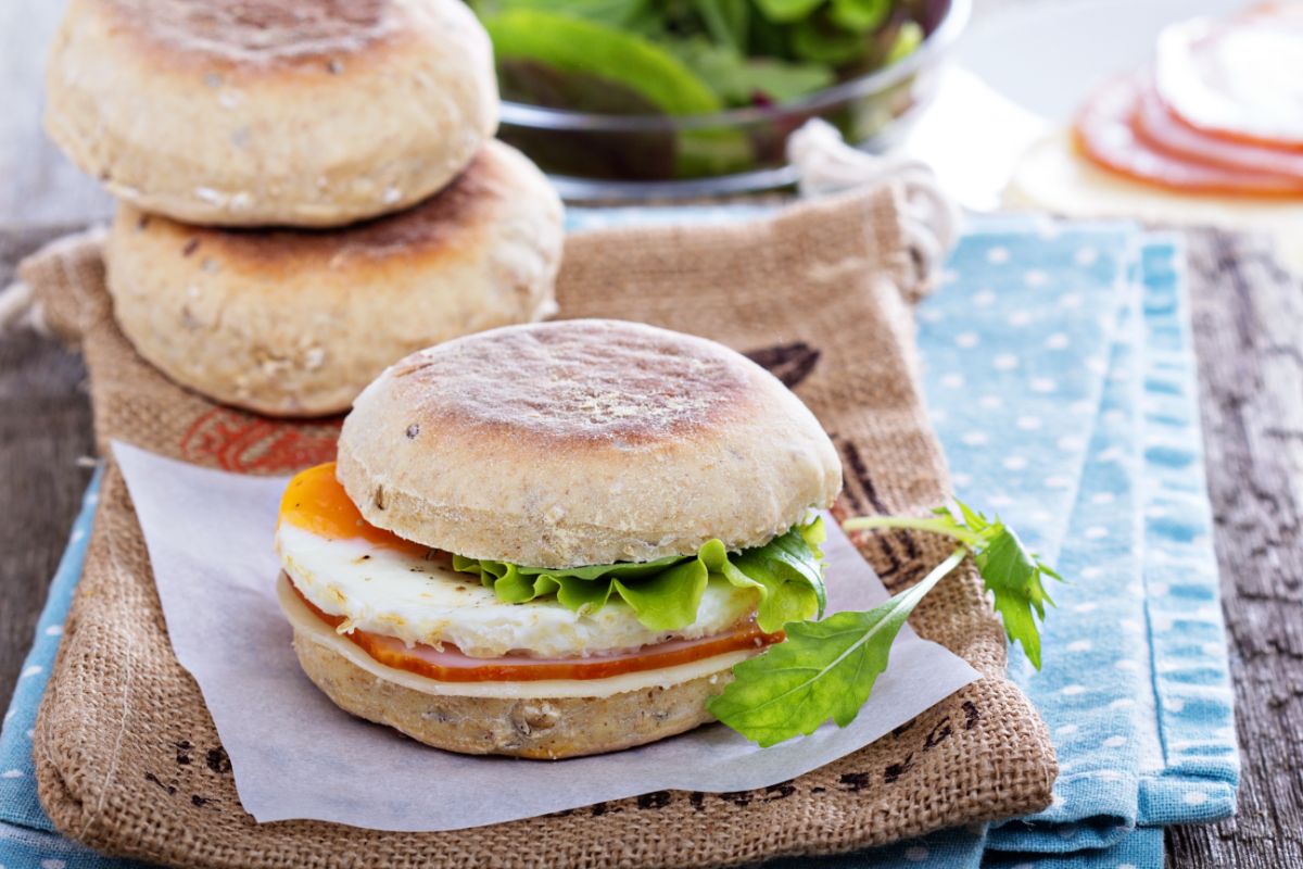 English muffin with egg and herbs on cloth wipes
