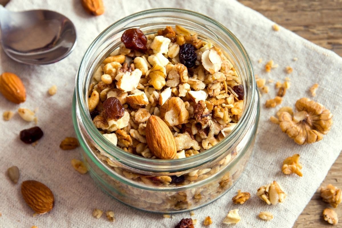 Glass jar full of different types of nuts