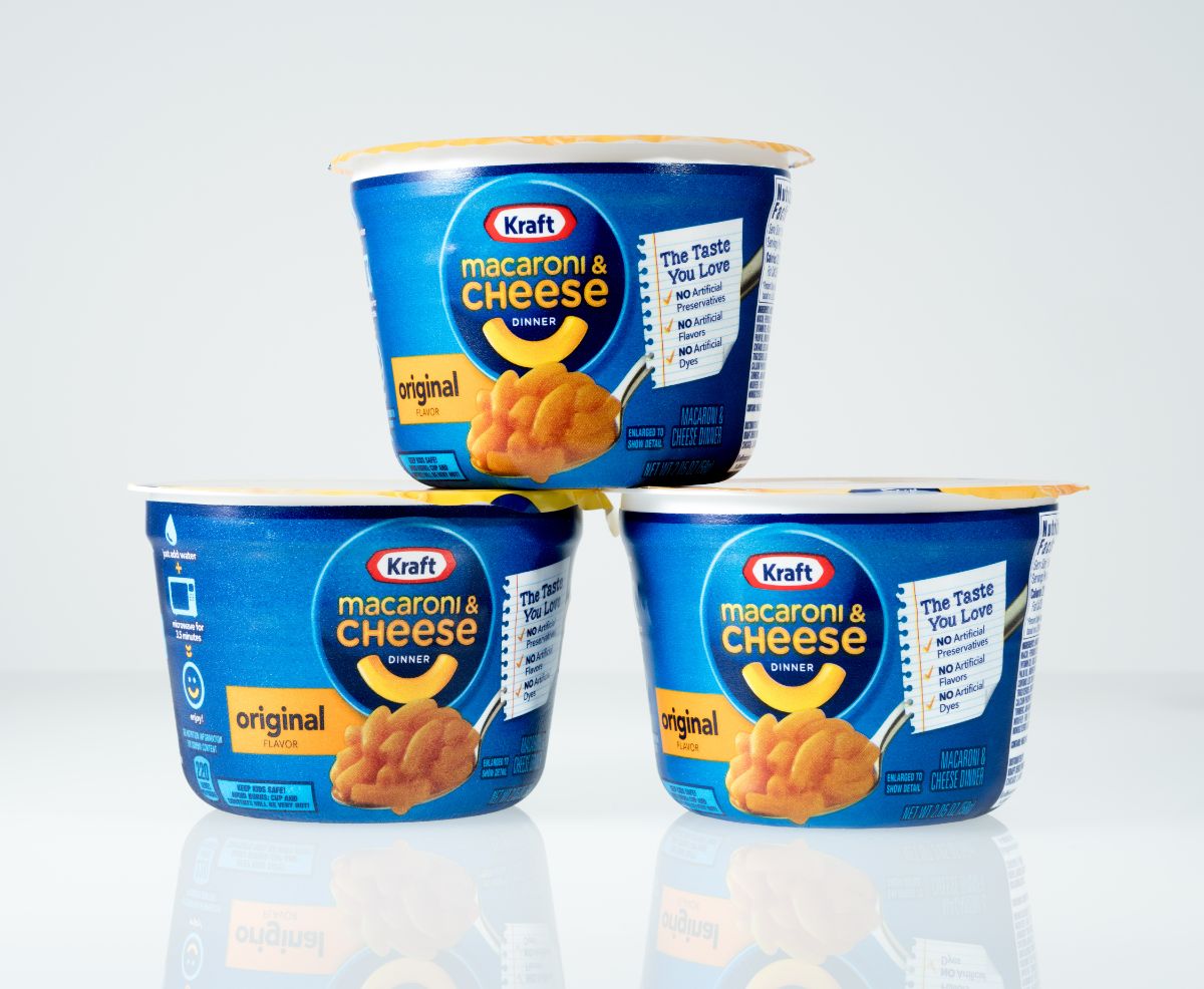 Three packages of krat mac and cheese on white background