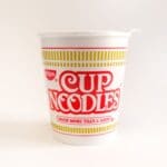 Nissin instant noodle cup on white background