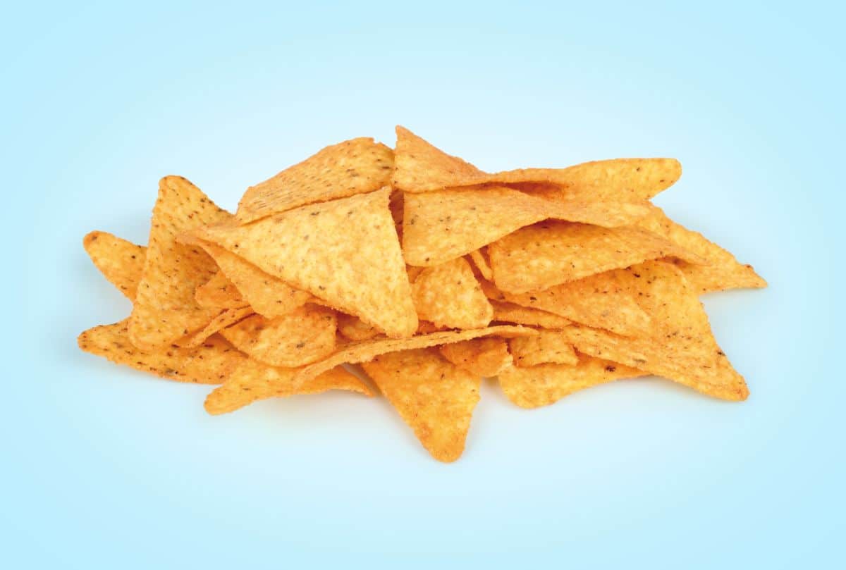 Pile of doritos on blue background