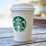Starbucks paper cup on wooden table