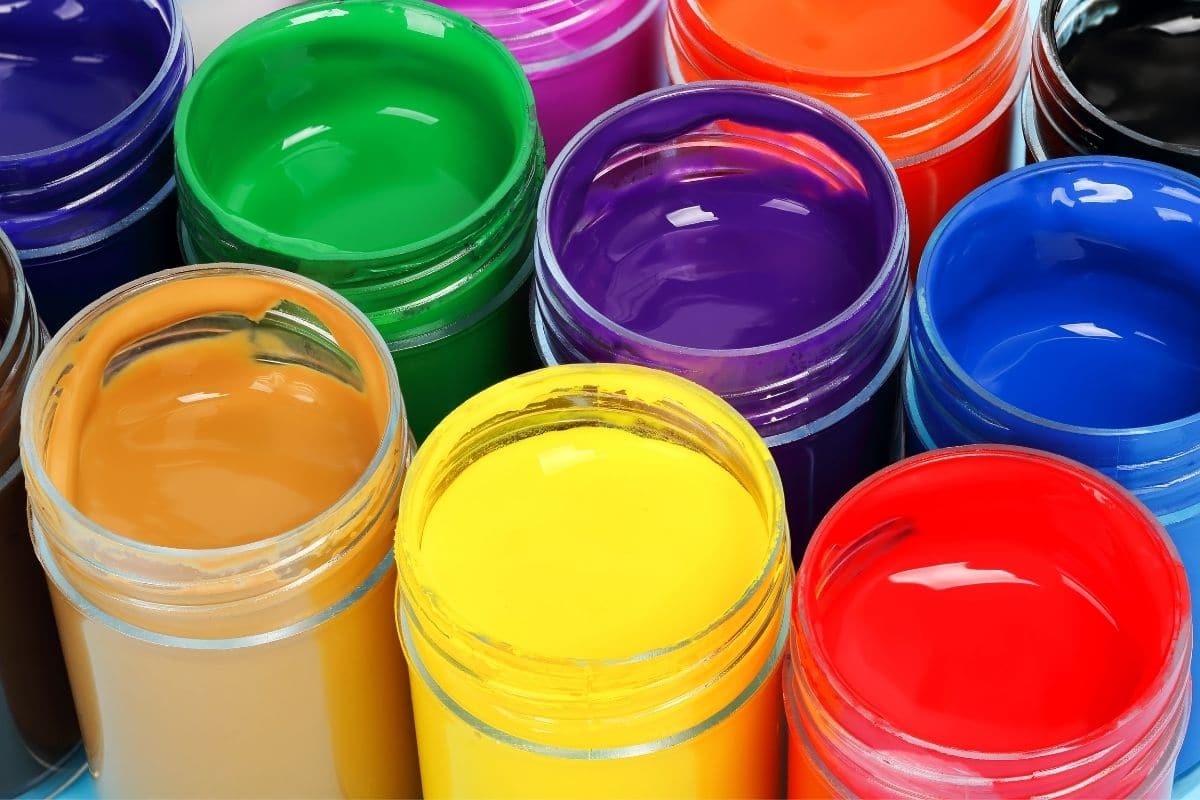 Different types of acrylic paint in containers