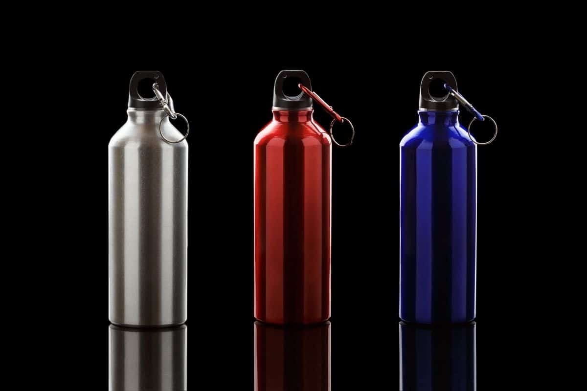 Colorful aluminium hydro flasks on black bacgkround