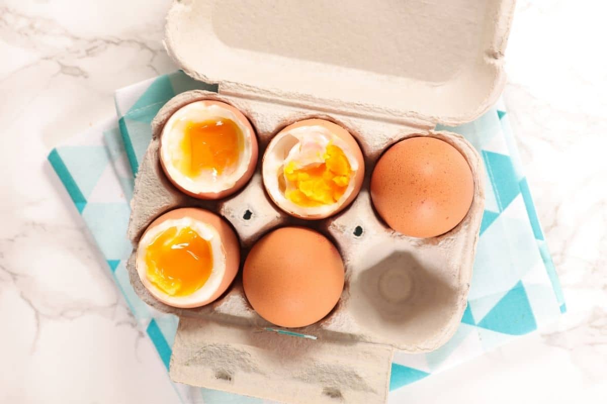 Boiled eggs in egg carton on wipe