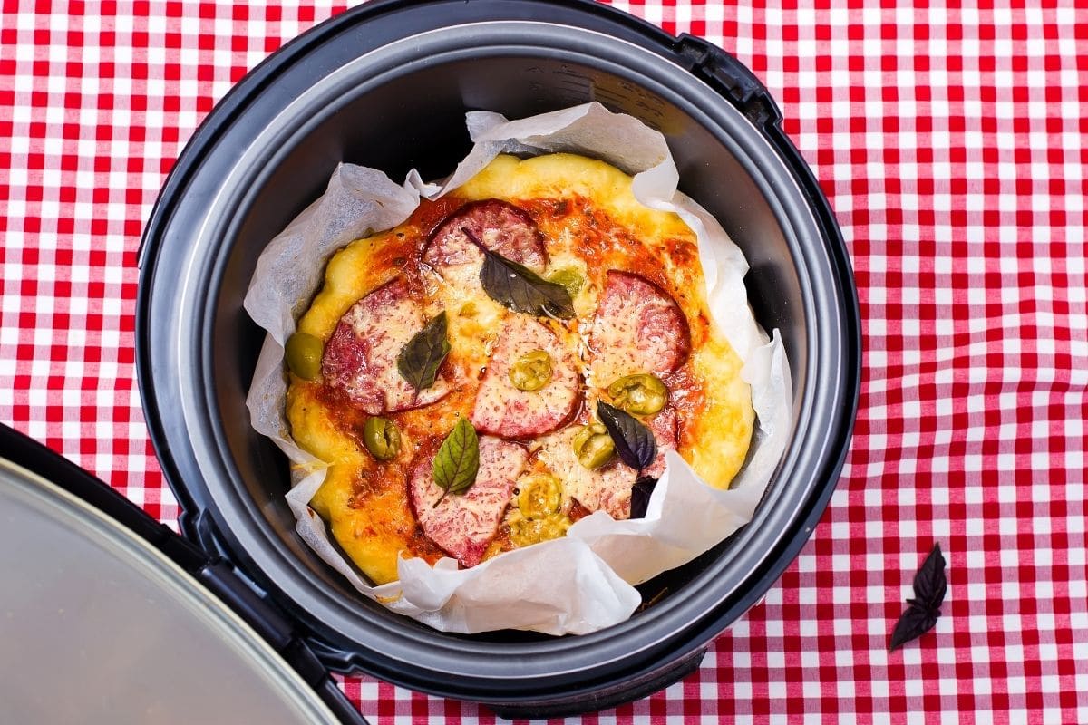 Crock pot with meal insite on red-white table cloth