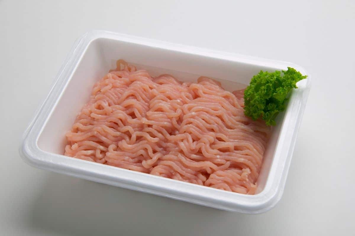 Ground turkey with herb in plastic container