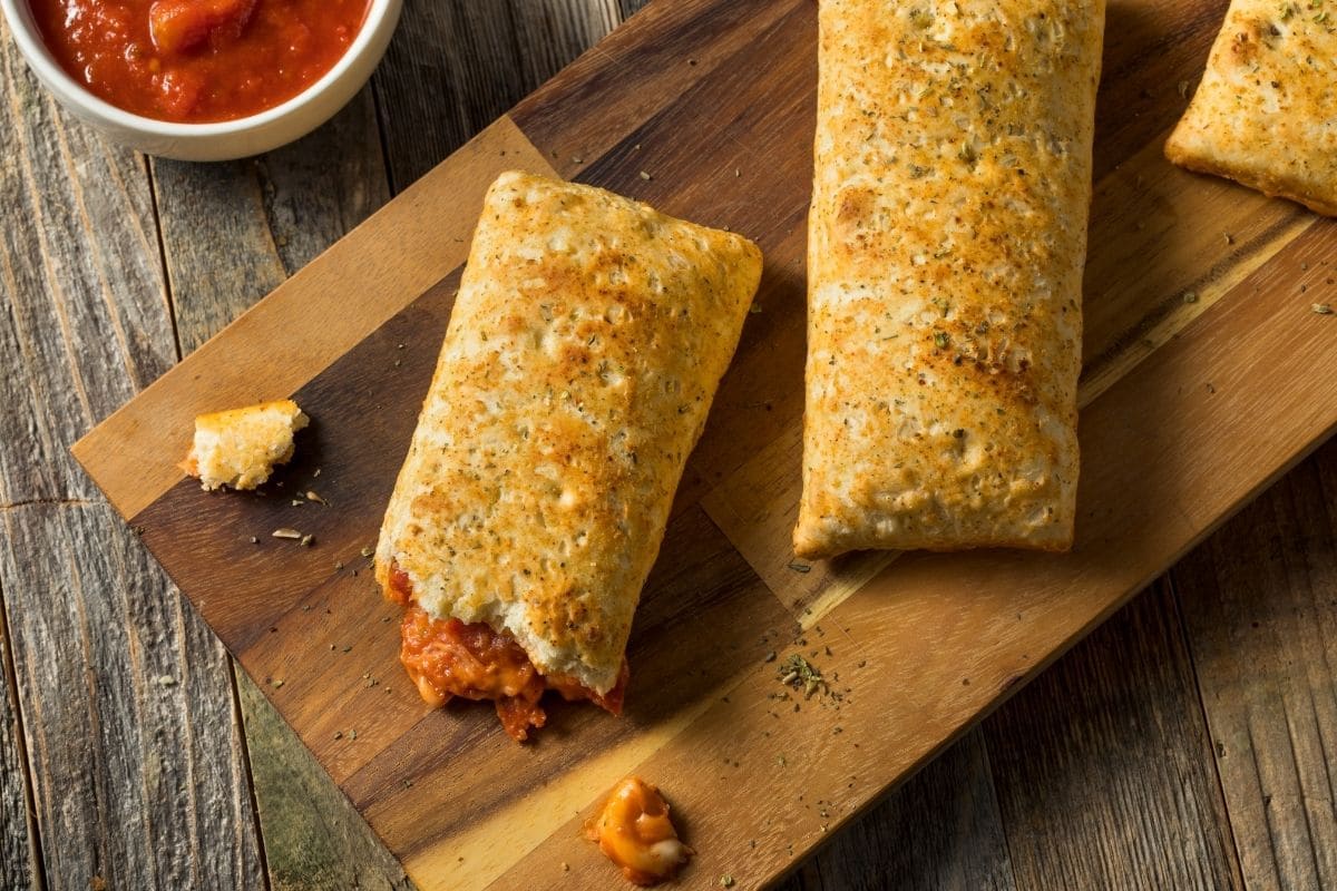 Hot pockets on wooden cutting board- top view