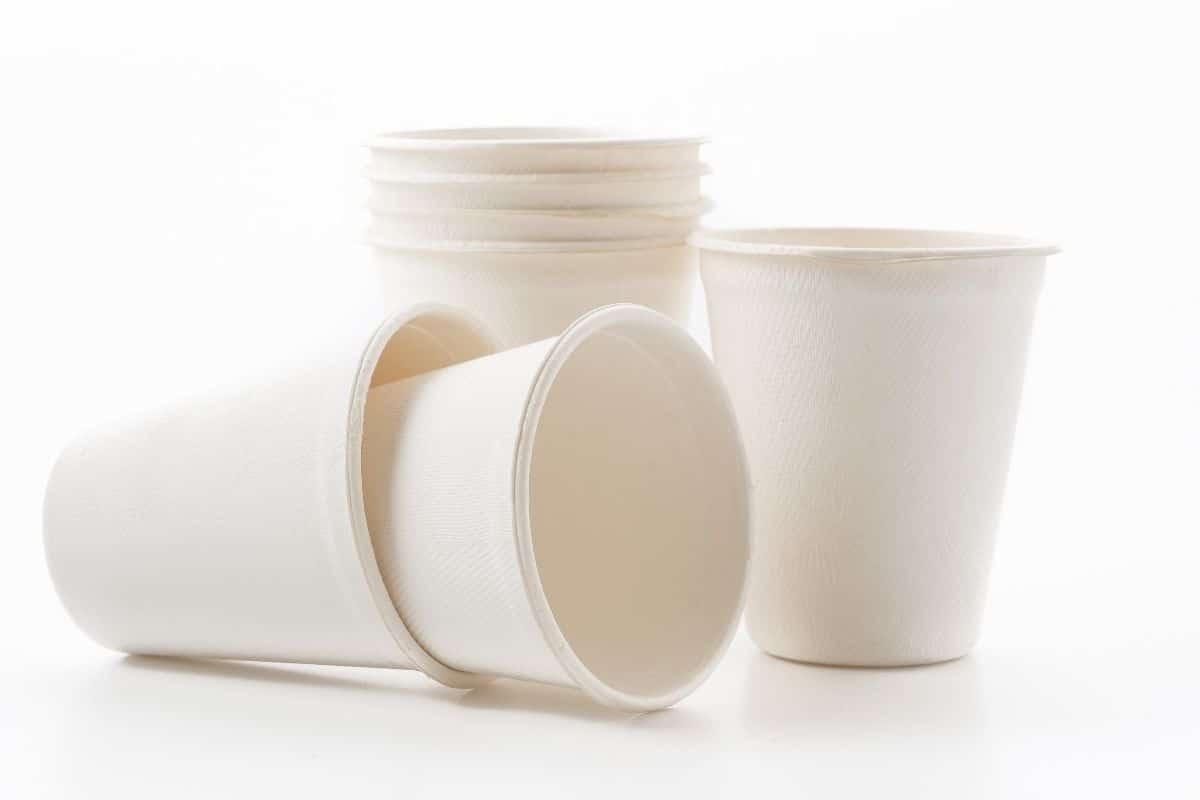 Bunch of paper cups on white background