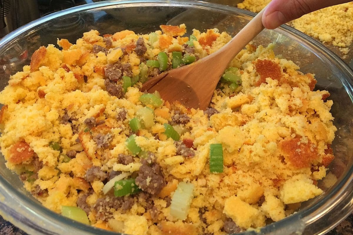 Stuffing mix mixed by wooden spoon in bowl