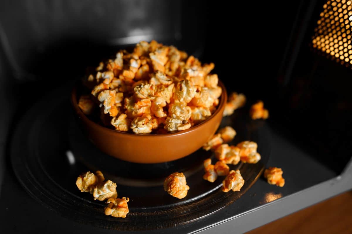 Bowl of popcorn in a microwave.