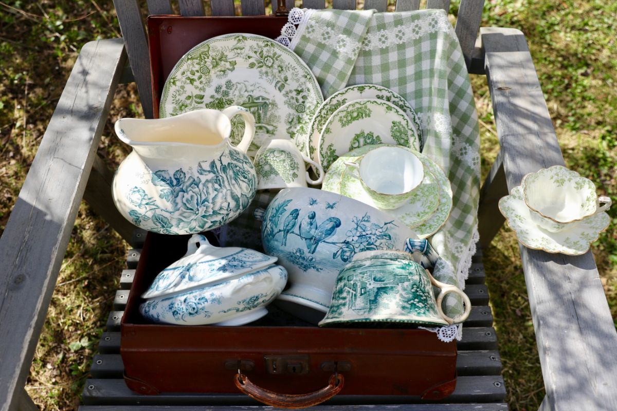 Different varieites of ironstone ware on a wooden bench,