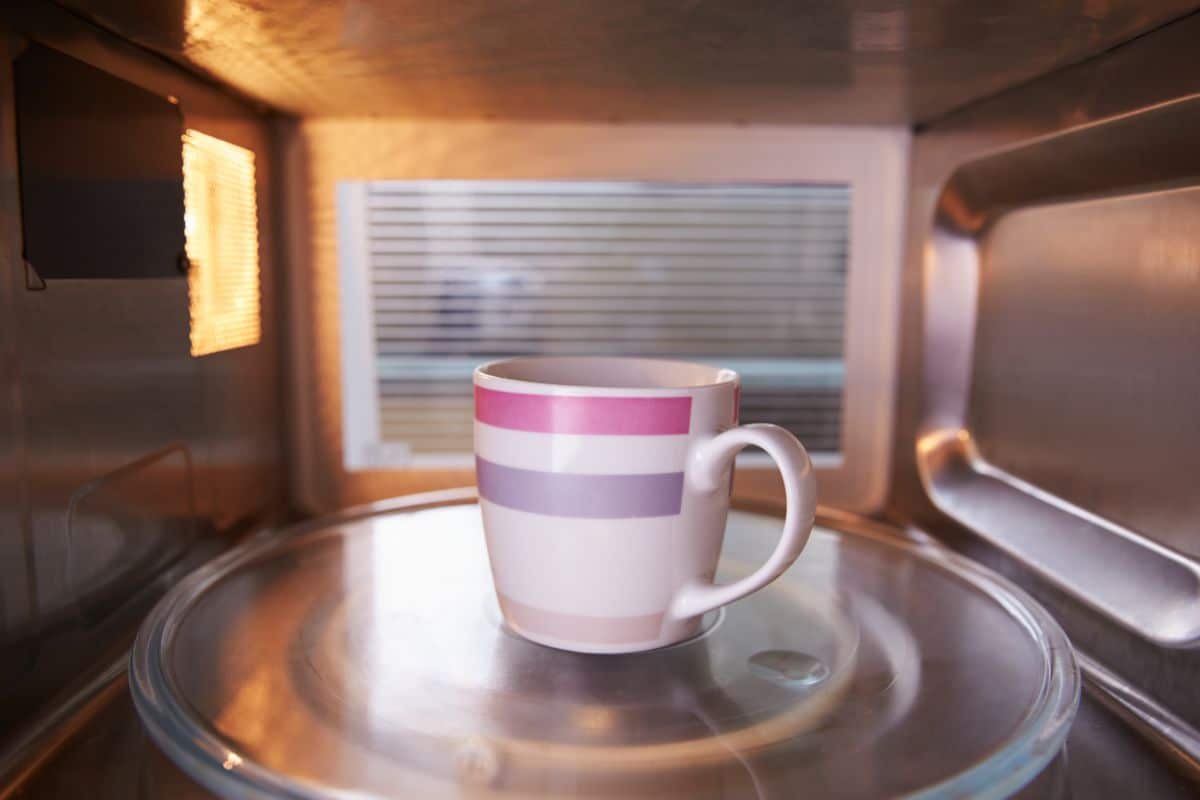 Warming a ceramic mug in a microwave.