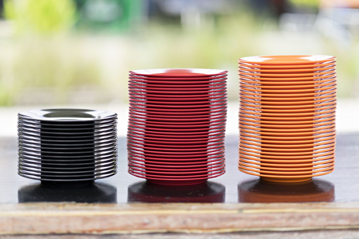 Stacks on modern looking melanine plates on a table.