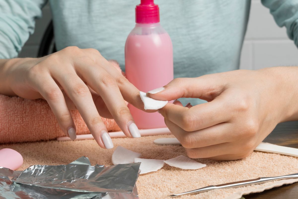 Woman removing polish nail.