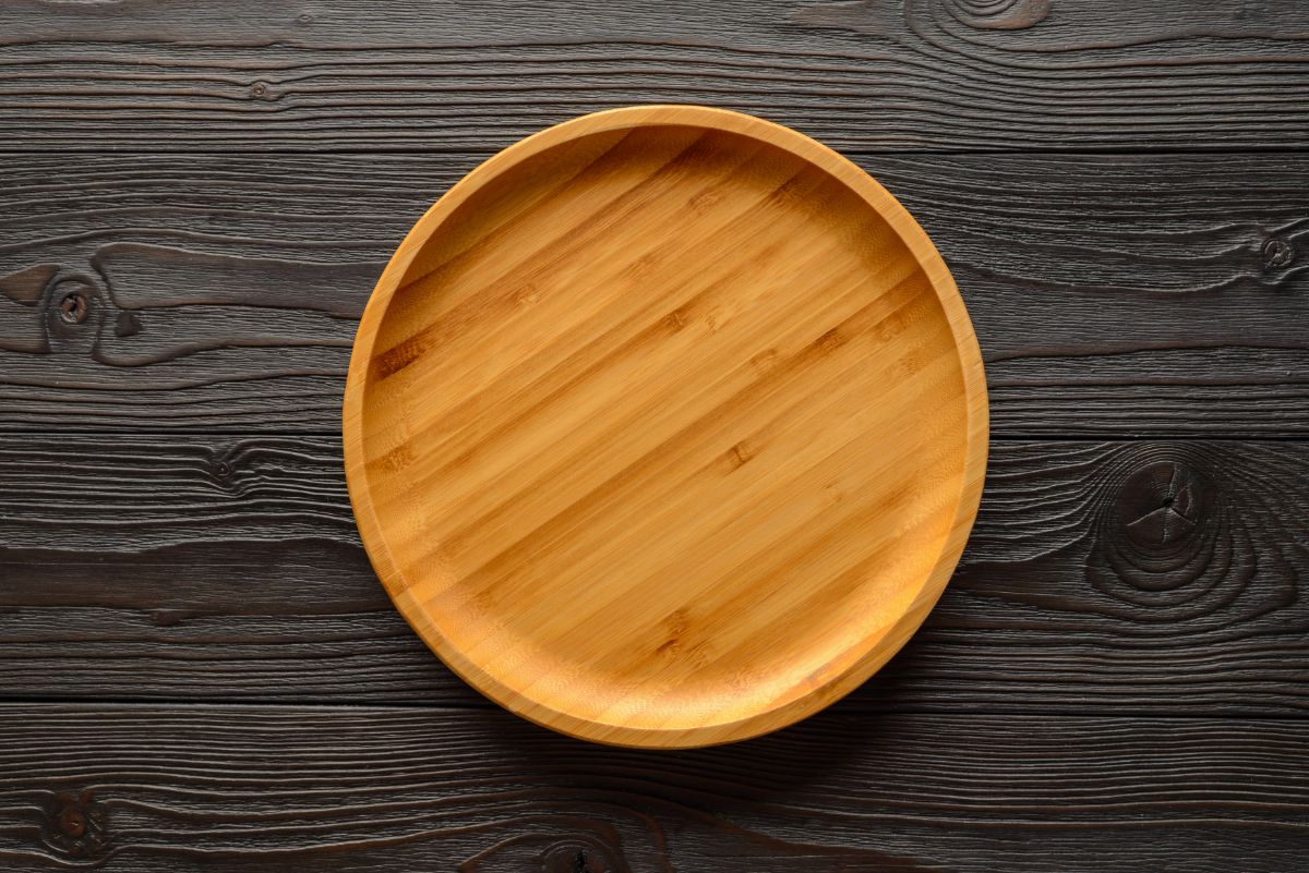 Bamboo plate on a black wooden table.