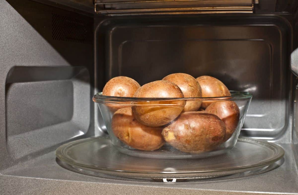 A glass bowl in a microwave.